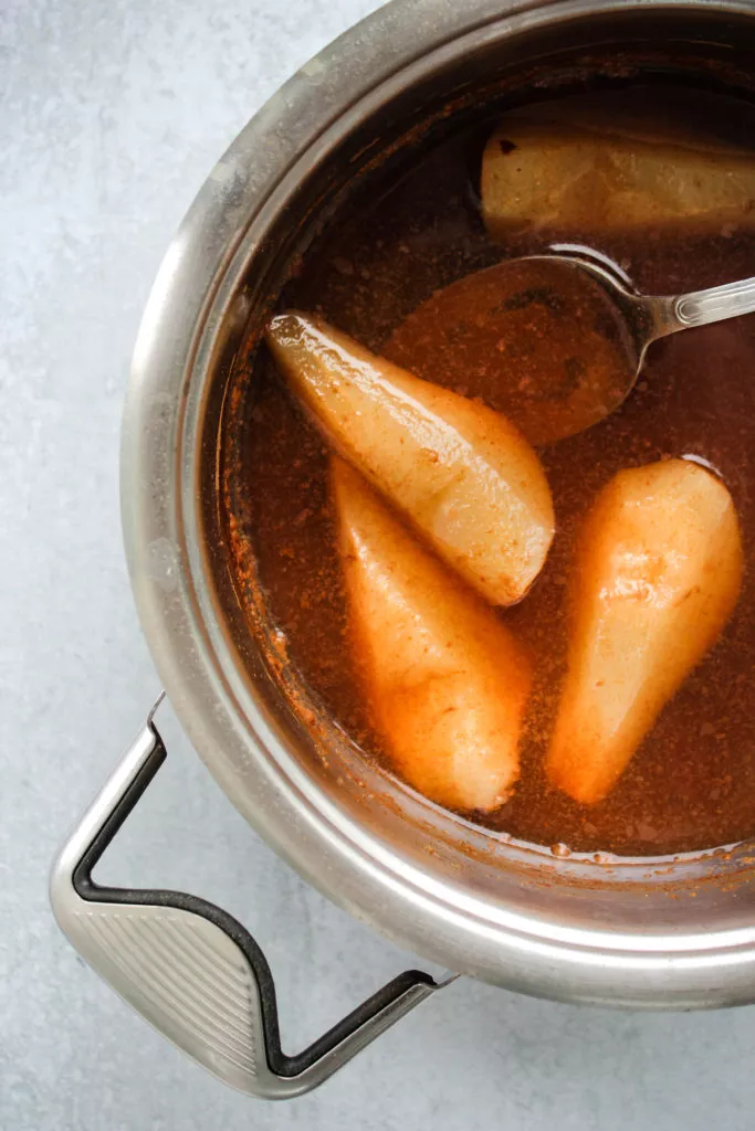 ginger cinnamon honey poached pears in a pot