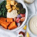 Macro bowl with roasted vegetables and a spicy vegan cashew cream sauce