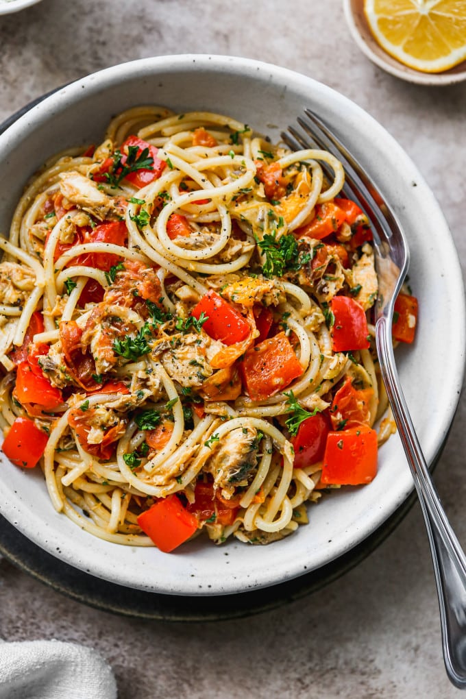 A serving of a Mediterranean canned mackerel pasta recipe in a white bowl.