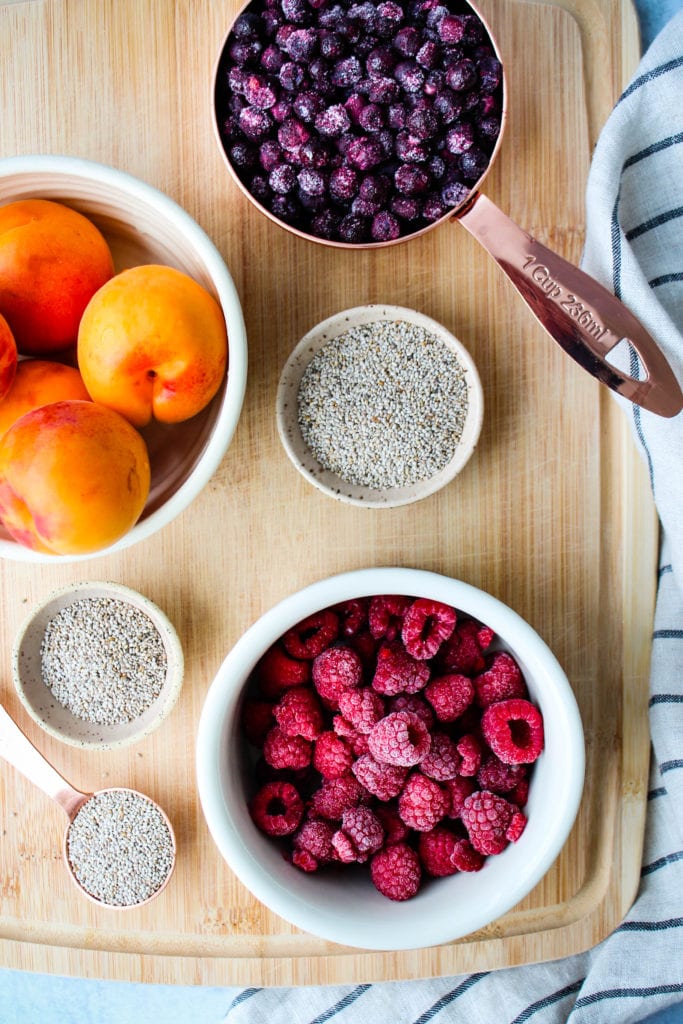 ingredients for blueberry, raspberry, and apricot chia seed jam