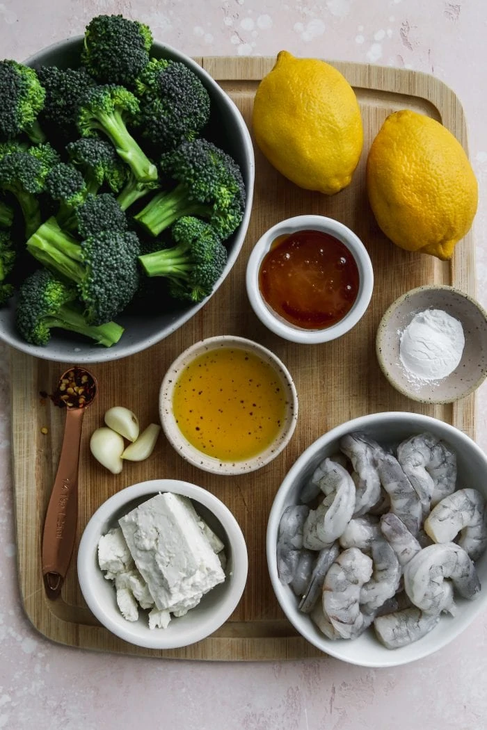 Overhead photo of bowls of ingredients on top of a wood cutting board.