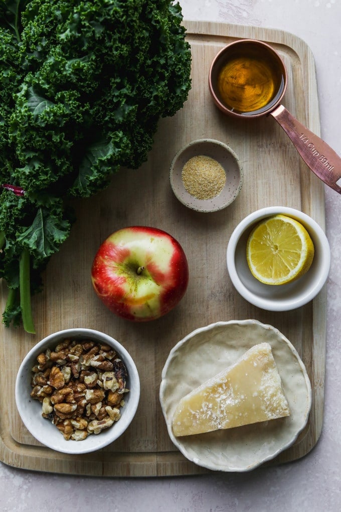 Overhead photo of small bowls of ingredients on a wood cutting board.
