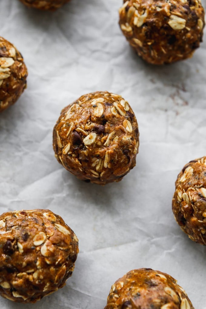 Closeup photo of almond butter energy balls on parchment paper.