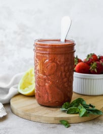 Strawberry balsamic vinaigrette in a glass jar.