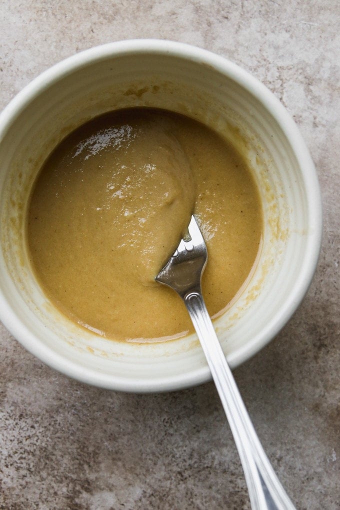 Miso maple tahini dressing mixed in a small bowl.
