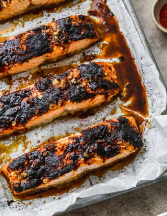 Baked chili salmon fillets on a baking sheet,