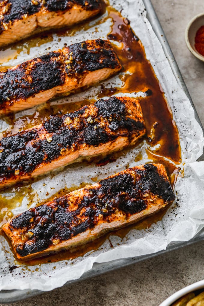 Baked chili salmon fillets on a baking sheet,