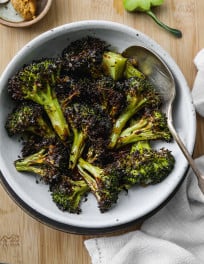 Roasted miso broccoli in a white serving bowl.