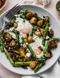 A serving of asparagus and eggs breakfast skillet.