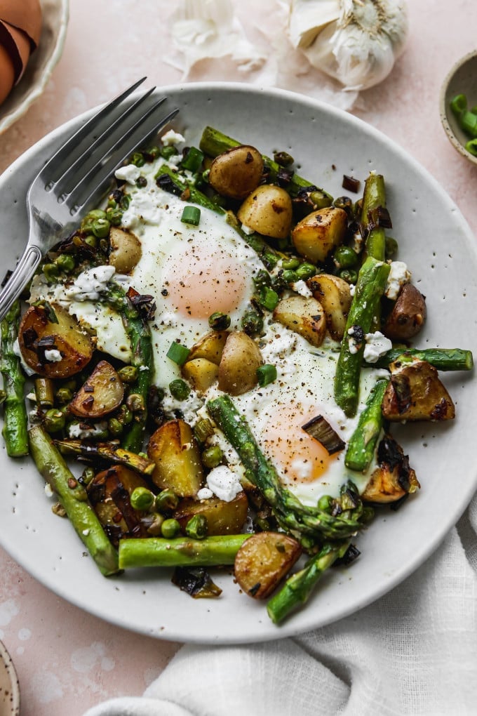 A serving of asparagus and eggs breakfast skillet.