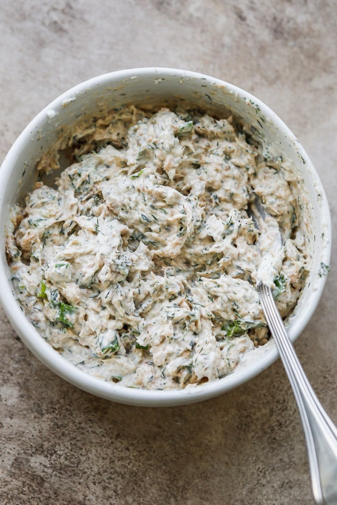 Salmon dip ingredients mixed together in a bowl.