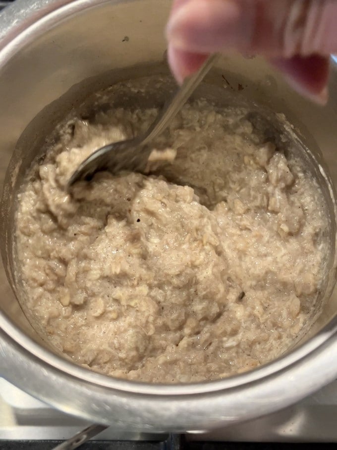 Protein oatmeal porridge cooked in a small pot.