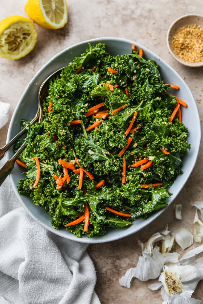 Asian kale salad with sesame dressing in a large bowl.