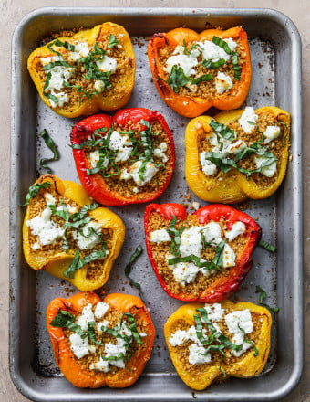 Couscous stuffed bell peppers topped with goat cheese and basil.