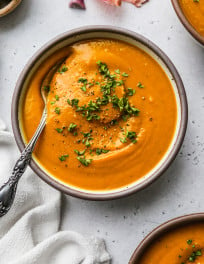 Curried kabocha squash soup in a bowl.