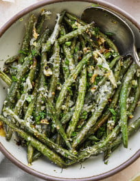 Roasted green beans served in a bowl.